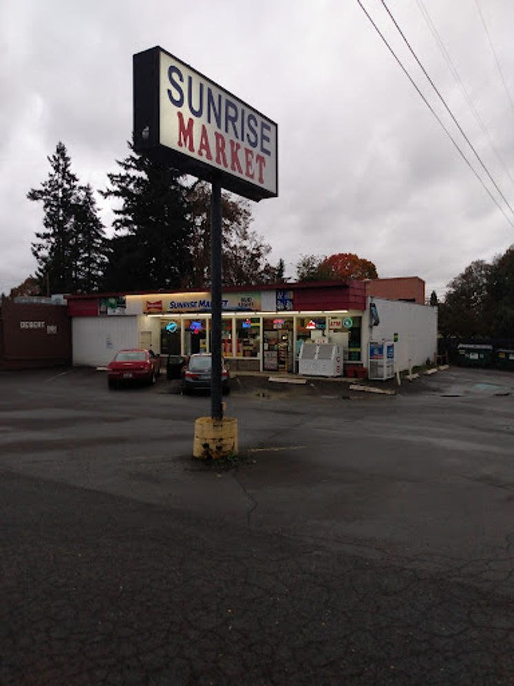 Sunrise Market roadside sign and storefront